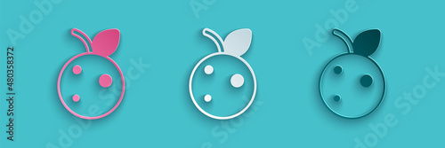 Paper cut Peach fruit or nectarine with leaf icon isolated on blue background. Paper art style. Vector