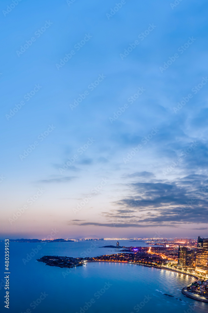 Obraz premium Aerial photography night view of modern city buildings in Qingdao, China