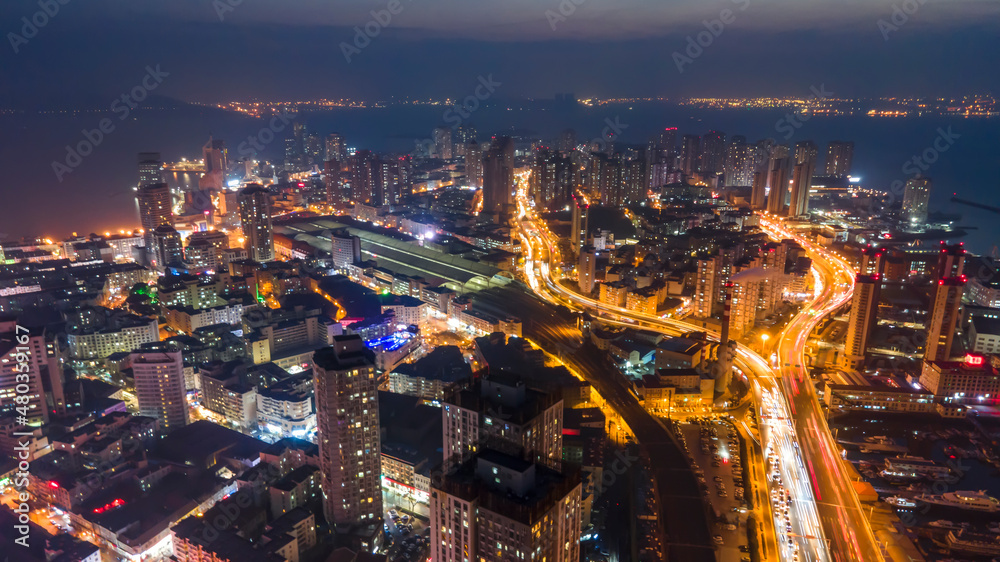 Aerial photography night view of modern city buildings in Qingdao, China