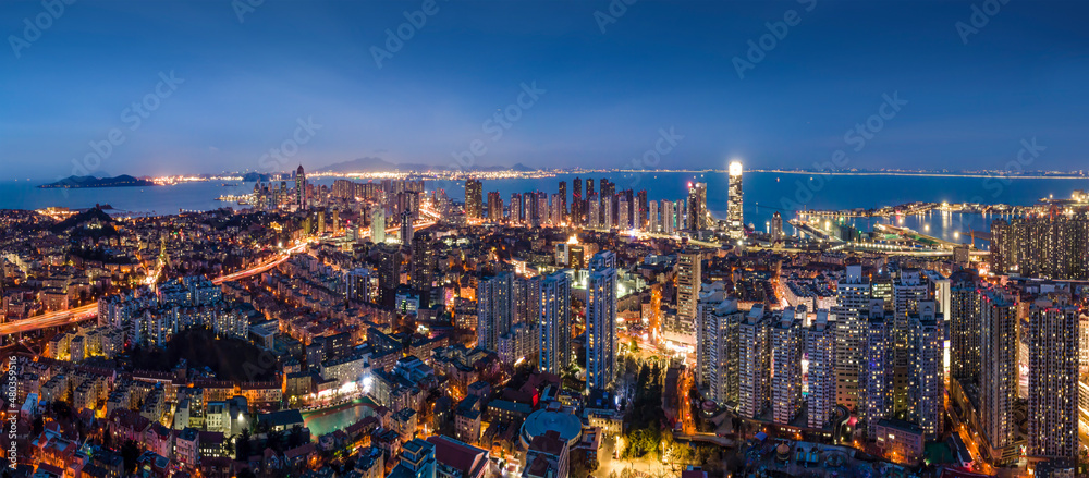 Aerial photography night view of modern city buildings in Qingdao, China - obrazy, fototapety, plakaty 