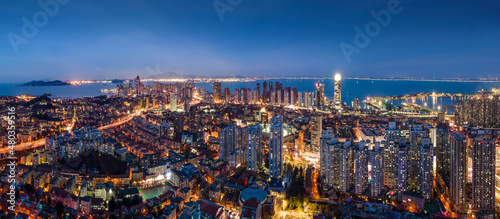 Aerial photography night view of modern city buildings in Qingdao, China © 昊 周
