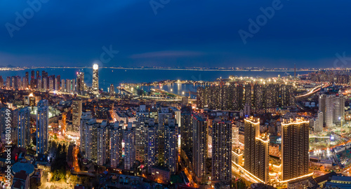 Aerial photography night view of modern city buildings in Qingdao  China