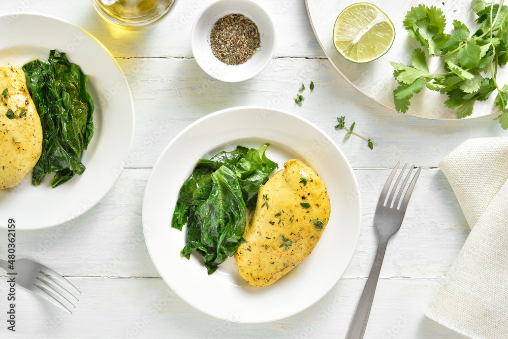 Baked turmeric chicken breast and sauteed spinach Baked turmeric chicken breast and sauteed spinach