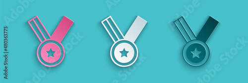 Paper cut Medal icon isolated on blue background. Winner achievement sign. Award medal. Paper art style. Vector