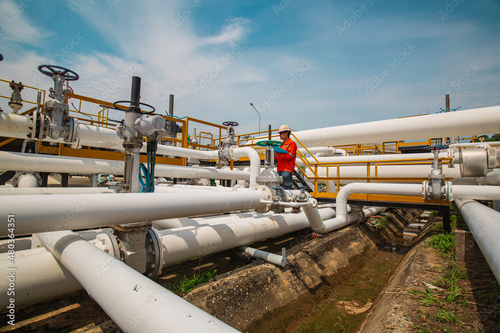 Male worker inspection at valve of visual check record pipeline oil and gas. Male worker inspection at valve of visual check record pipeline oil and gas.