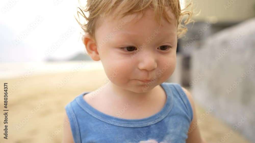 4K Portrait of Cute Caucasian baby boy toddler walking and playing on the beach in summer sunny day. Happy family with little child boy kid enjoy outdoor lifestyle activity on holiday travel vacation 4K Portrait of Cute Caucasian baby boy toddler walking and playing on the beach in summer sunny day. Happy family with little child boy kid enjoy outdoor lifestyle activity on holiday travel vacation