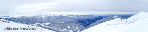 Panoramic winter landscape: The Rosa Khutor Alpine Resort near Krasnaya Polyana panoramic background. © Quatrox Production