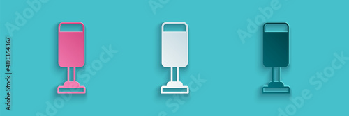Paper cut Punching bag icon isolated on blue background. Paper art style. Vector