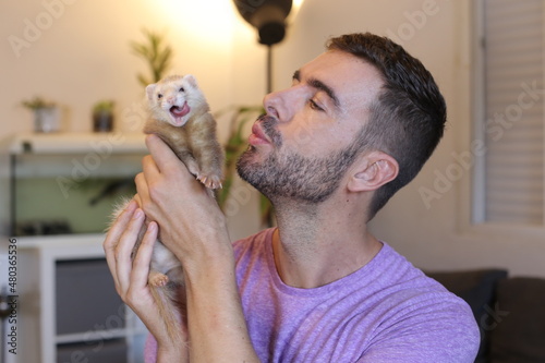 Man with a playful ferret