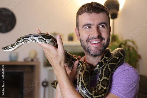 Man with beautiful pet snake 