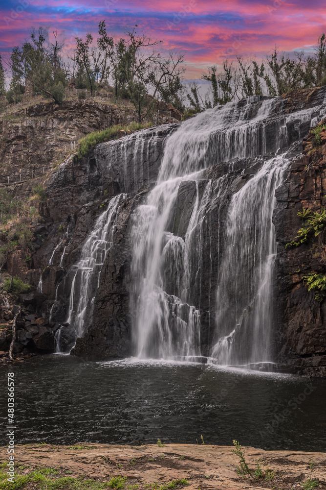 Obraz premium beautiful Australian waterfalls at sunset central australia.