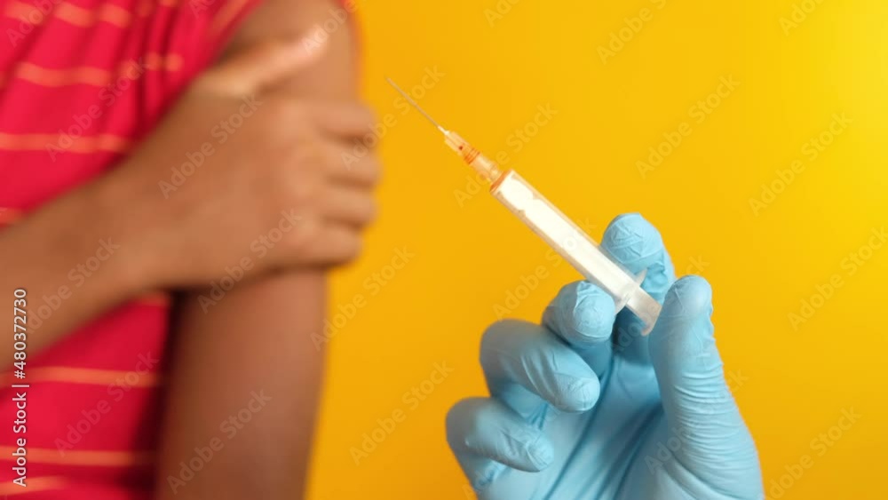 doctor hand in medical gloves holding syringe. doctor hand in medical gloves holding syringe.