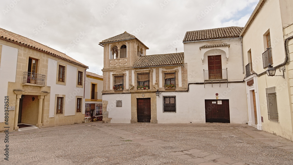 Square wiht tradtional houses and little tower in Cordoba, Spain