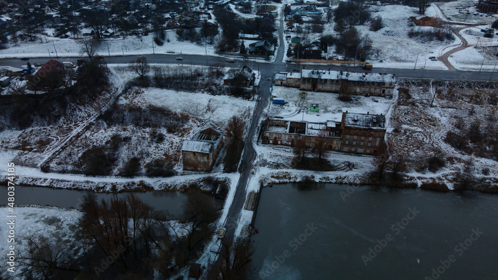 Flying in a suburban park. City blocks are visible. Winter cityscape. Aerial photography. Flying in a suburban park. City blocks are visible. Winter cityscape. Aerial photography.