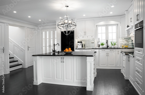 Beautiful, hampton style, wooden kitchen with large island photo