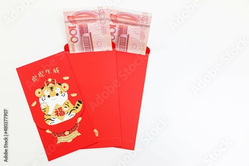 Fotografija Chinese New Year lucky red envelopes for tiger year with 100 Chinese Yuan notes