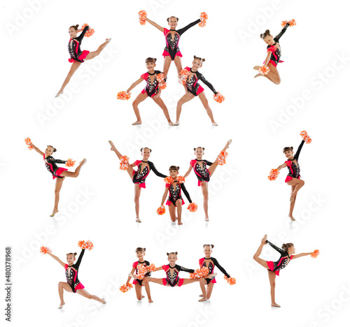 Принти на полотні Full-length portrait of three girls, cheerleaders training isolated over white background