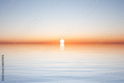 Fototapeta Sun on horizon over water surface with waves