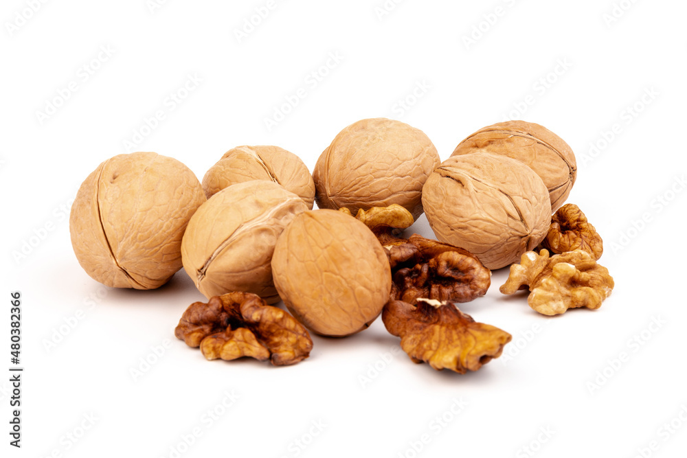 Walnuts in shells isolated on white background. Package design element with clipping path. Walnuts in shells isolated on white background. Package design element with clipping path.