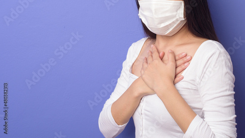 portrait of young woman is wearing face mask on Blue background