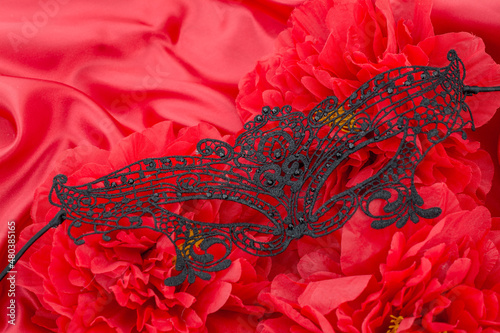 red sexy background with flowers and mask for Valentines day