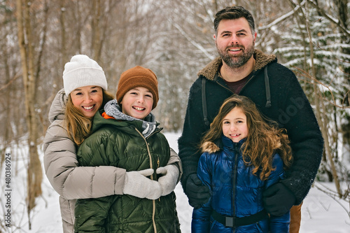 Portrait of a four Family On forest Winter season