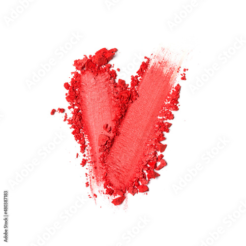 Close-up of make-up swatches. Smears of crushed red eye shadow or blusher
