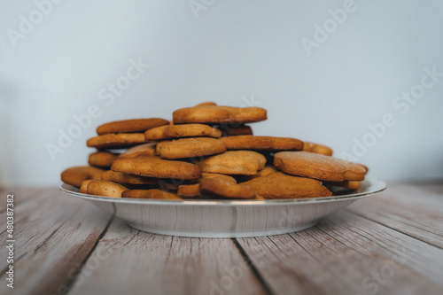 Front view of gingerbread cookies in plate on the table