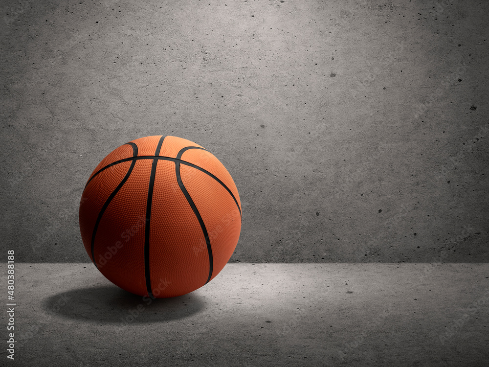 Basketball on cement wall background