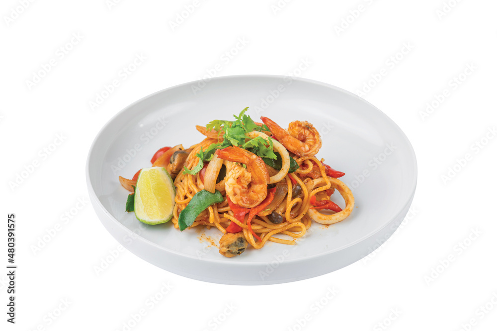 Spaghetti Tom Yum Seafood in white plate