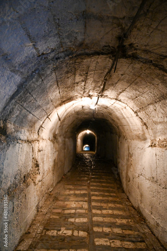 Illuminated tunnel or underpass under the Kalaja e Gjirokastres Castle of Gjirokastra in Albania