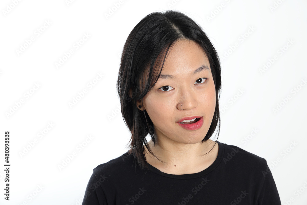Young attractive south east asian woman pose face expression emotion on white background smile witty Young attractive south east asian woman pose face expression emotion on white background smile witty
