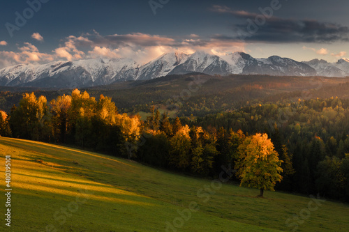 Colorful autumn near the Tatras. Peaks and hills bathed in the light of the setting sun. © PawelUchorczak