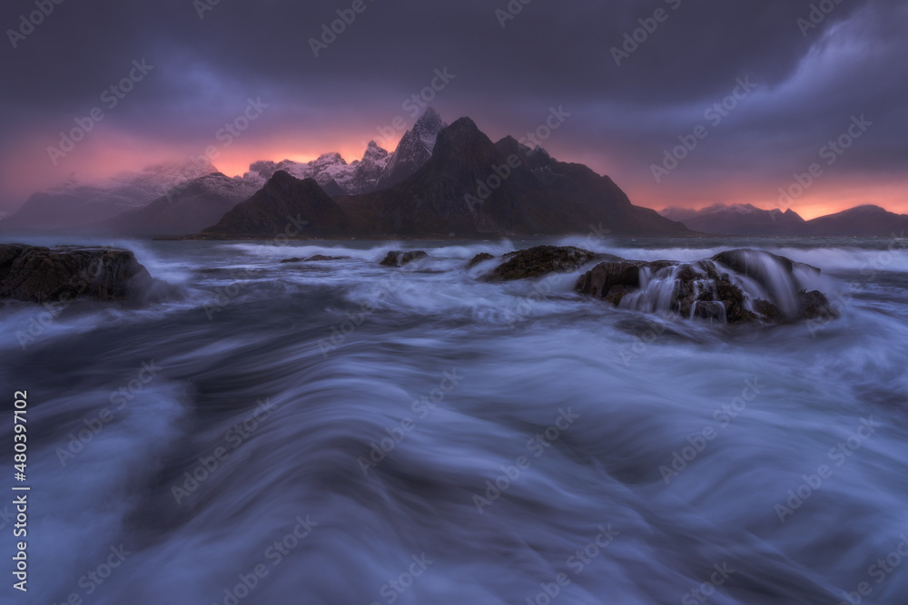 River flowing between mountains in fog River flowing between mountains in fog