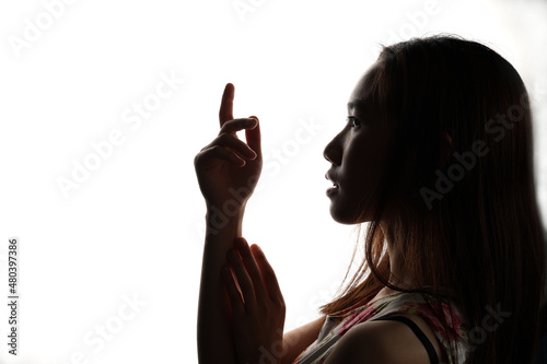 Silhouette dark black portraits of young southeast Asian woman on white background romance love care friends emotion expression thoughts