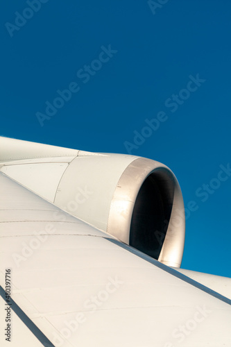 wing of aircraft with clear blue sky as vacation symbol