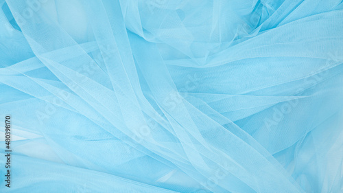 Beautiful layers of delicate light blue fabric background.