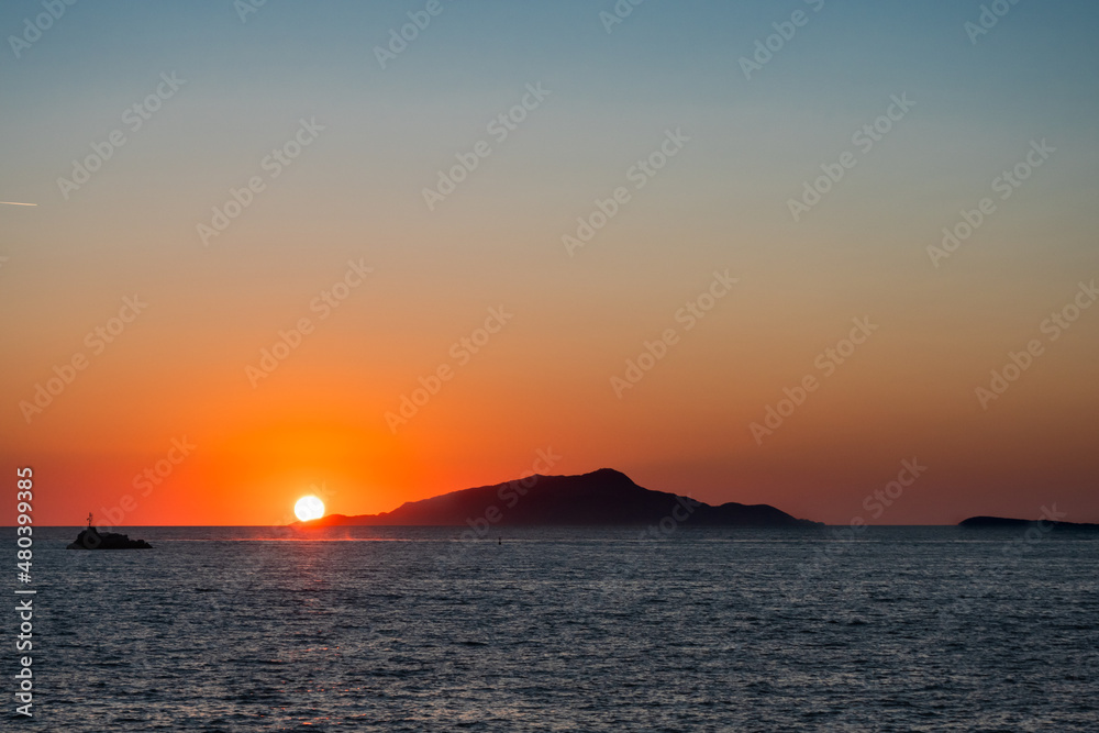 Naklejka premium Ischia Island Orange Sunset in Italy in the Tyrrhenian Sea