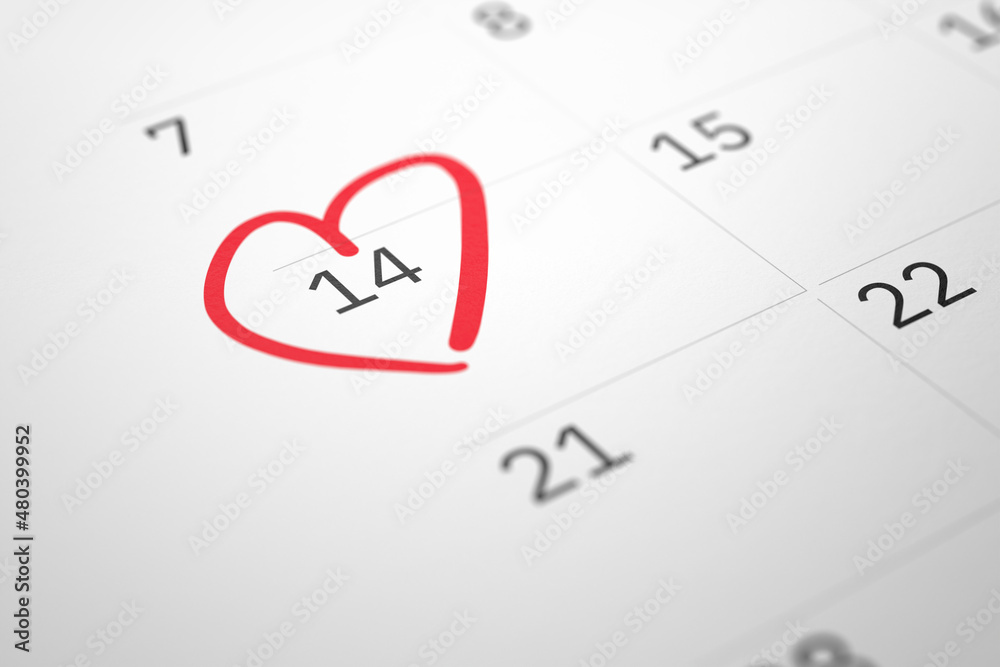 White paper planner calendar with red heart shape mark on 14 February - obrazy, fototapety, plakaty 