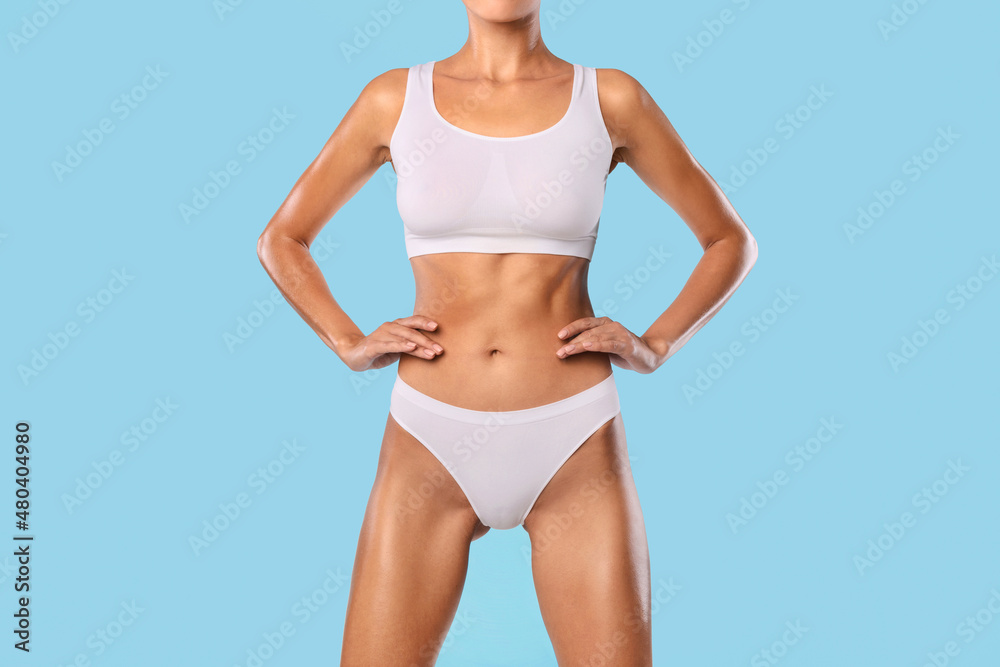 Closeup Of Lady Posing Isolated On Blue Studio Background Closeup Of Lady Posing Isolated On Blue Studio Background