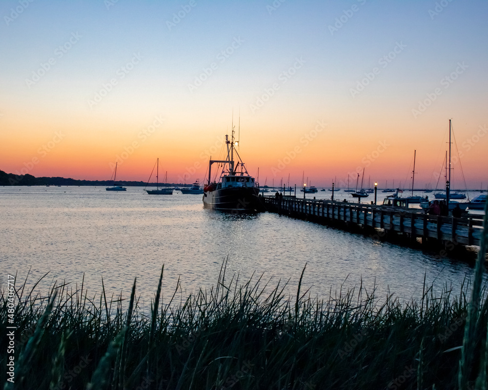 Fototapeta premium Sunset in the harbor. Pier at night.