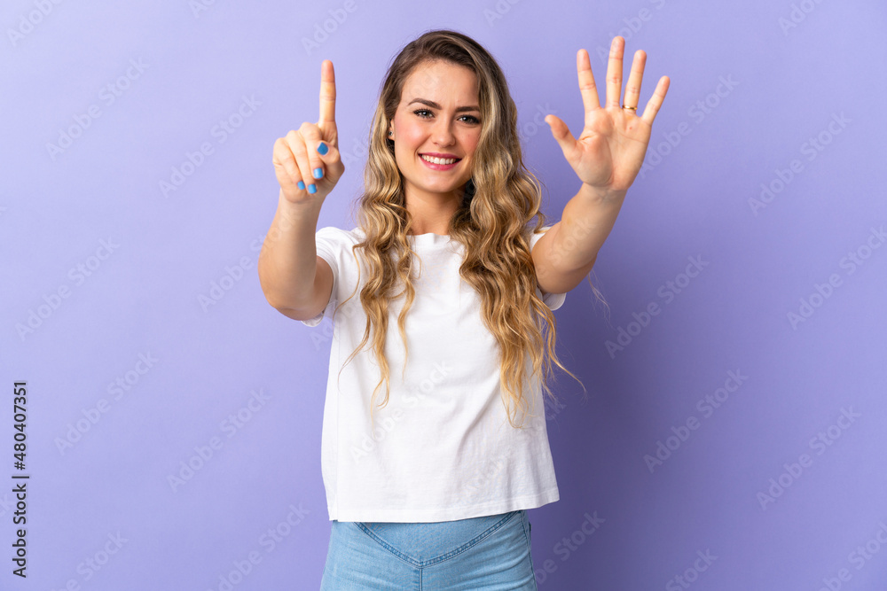 Young Brazilian woman isolated on purple background counting six with fingers Young Brazilian woman isolated on purple background counting six with fingers