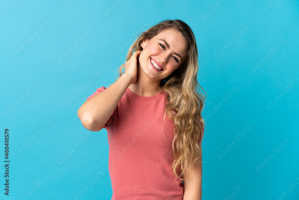 Young Brazilian woman isolated on blue background laughing