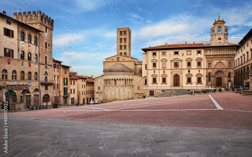 Arezzo, Tuscany, Italy: the main square Piazza Grande with the medieval church and buildings, in the old town of the ancient Italian city of art
