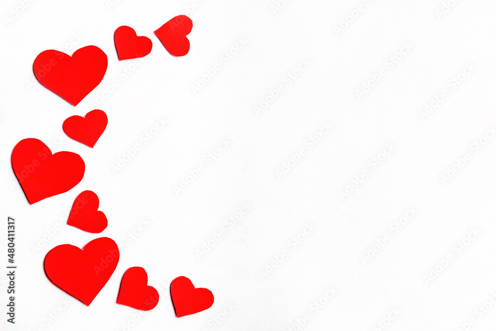 Red heart background, romantic paper clipping concept, top view. The concept of a greeting card for Valentine's Day or for the anniversary of Mother's Day.