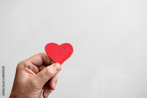 Valentine's Day background. Red hearts in your hand . Copy space.