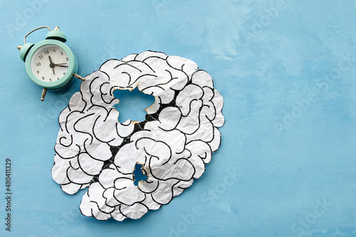  brain made of paper damaged by old age. Age-related changes and mental health. Signs of dementia and head disease.