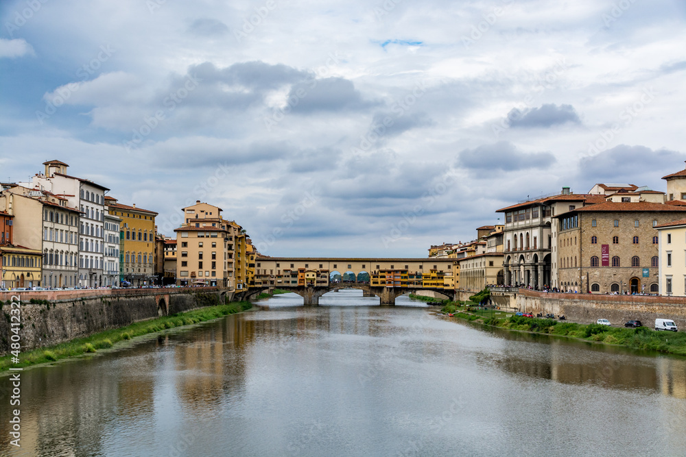 Ponte Vecchio, old bridge over Arno River on a cloudy day, Florence, Tuscany, Italy