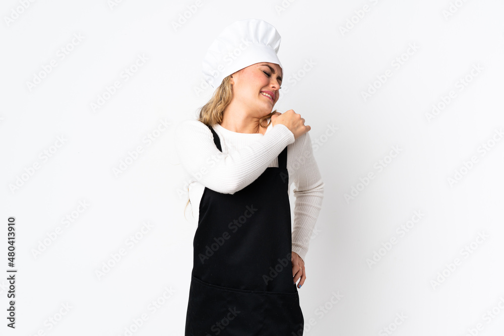Young Brazilian chef woman isolated on white background suffering from pain in shoulder for having made an effort Young Brazilian chef woman isolated on white background suffering from pain in shoulder for having made an effort