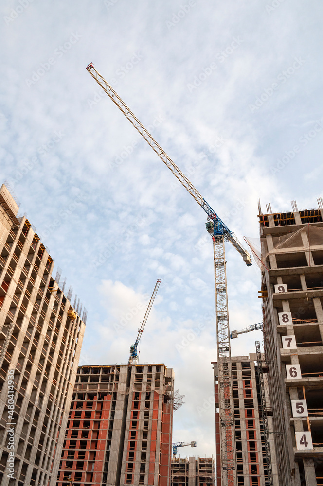 Fototapeta premium A crane on the construction of a high-rise building. Saint-Petersburg